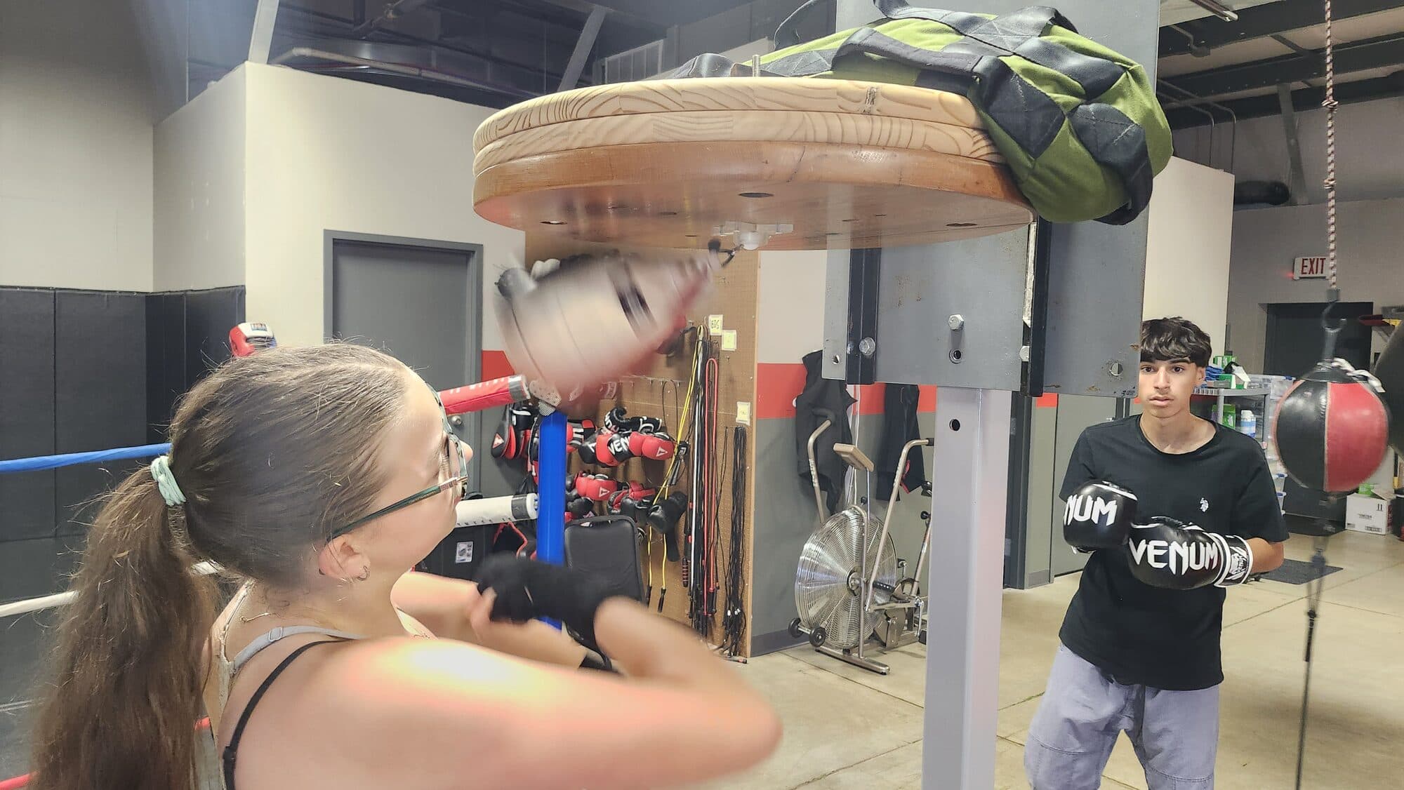 A woman throwing a punch during a boxing class at Barrick BJJ in Goshen