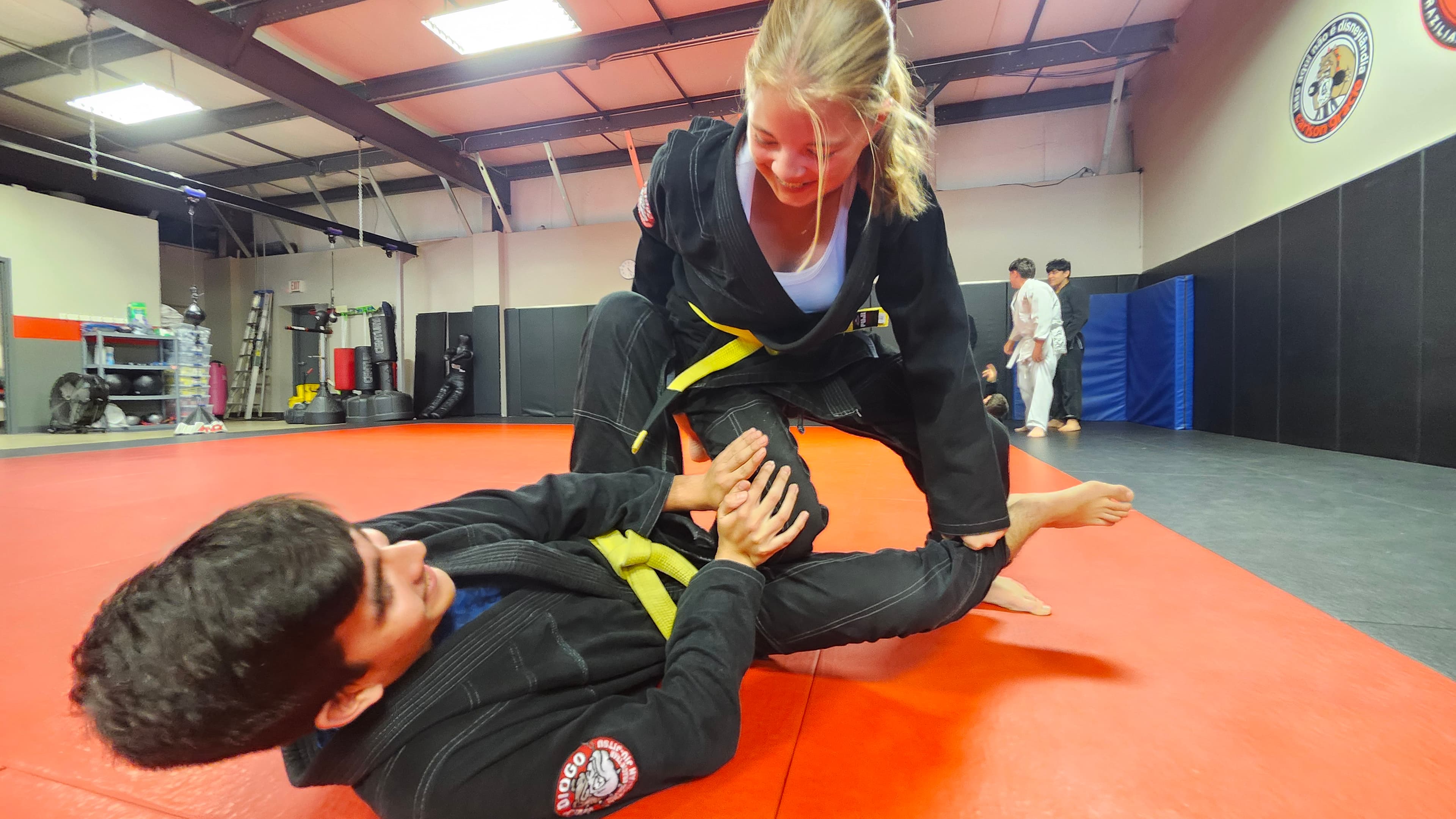 Teen students practicing a guard technique together at Barrick BJJ